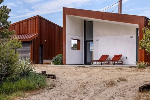 a view of a backyard with a tub and a potted plant