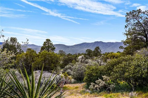 a view of a two chairs in the roof deck