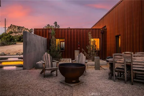 a view of a chairs and tables in the patio