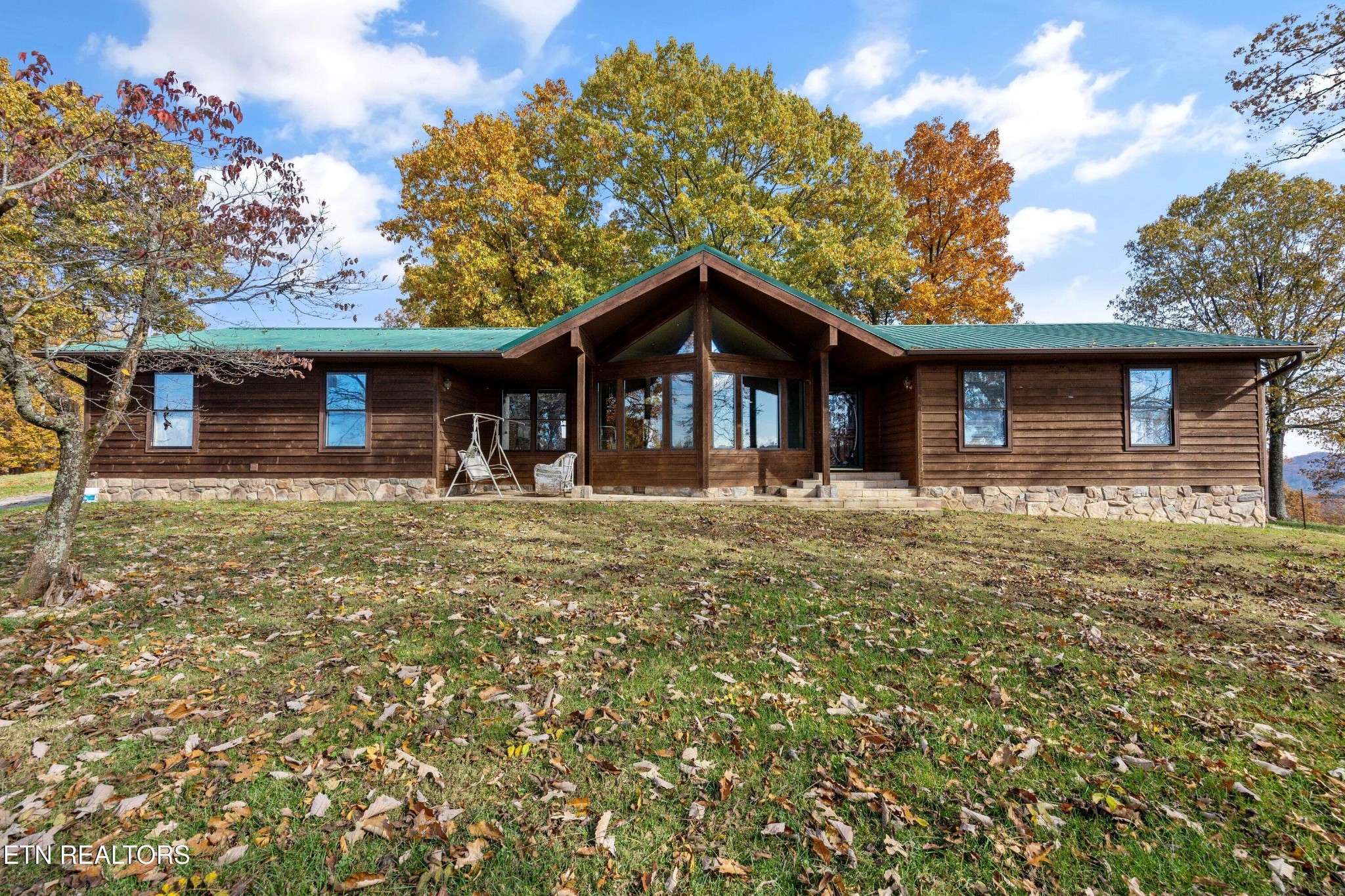 235 Davidson Hollow Road Heiskell, TN 37754 - Photo 2 of 43 a front view of a house with a yard