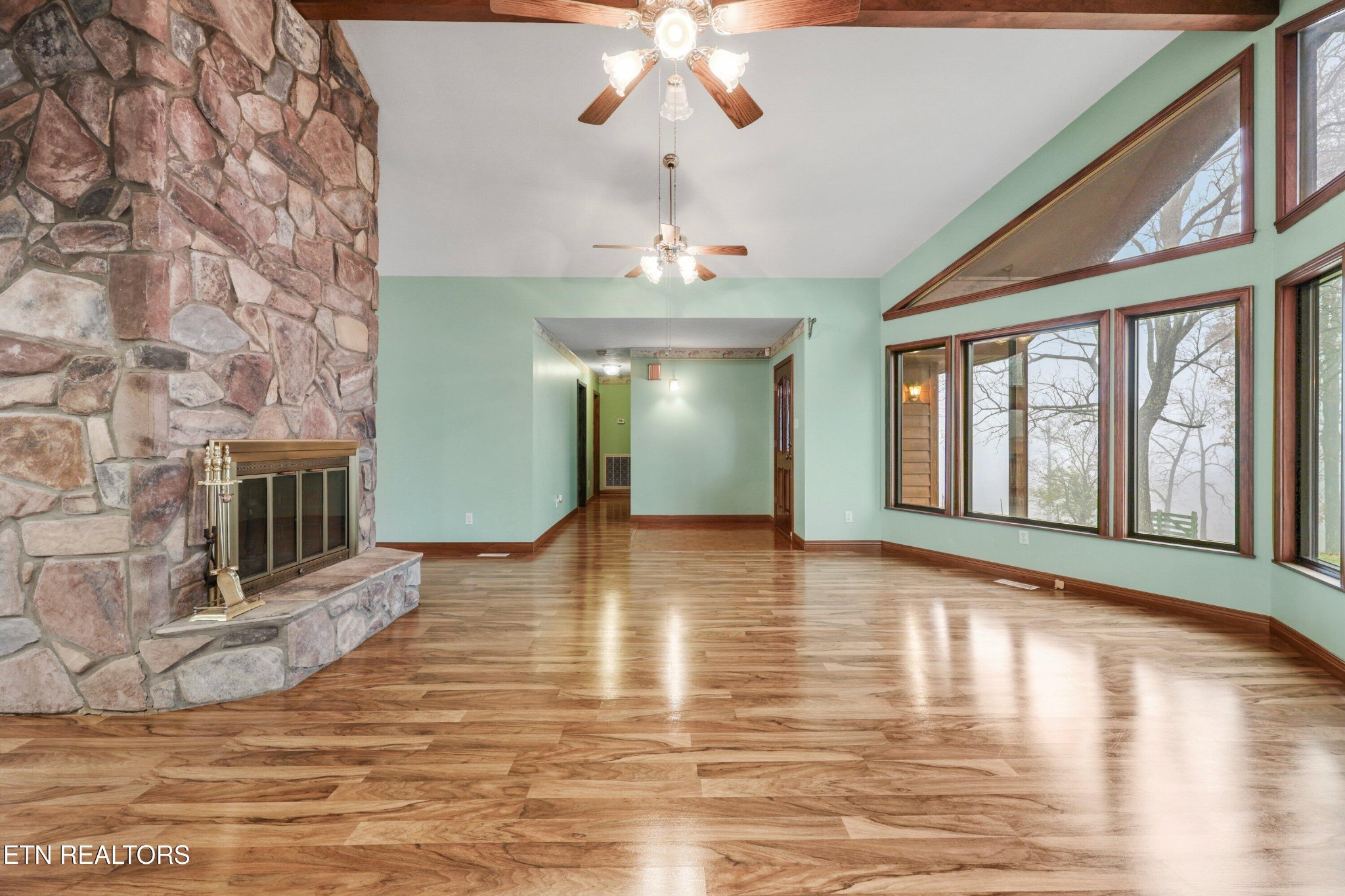 235 Davidson Hollow Road Heiskell, TN 37754 - Photo 26 of 43 a view of an empty room with window and wooden floor