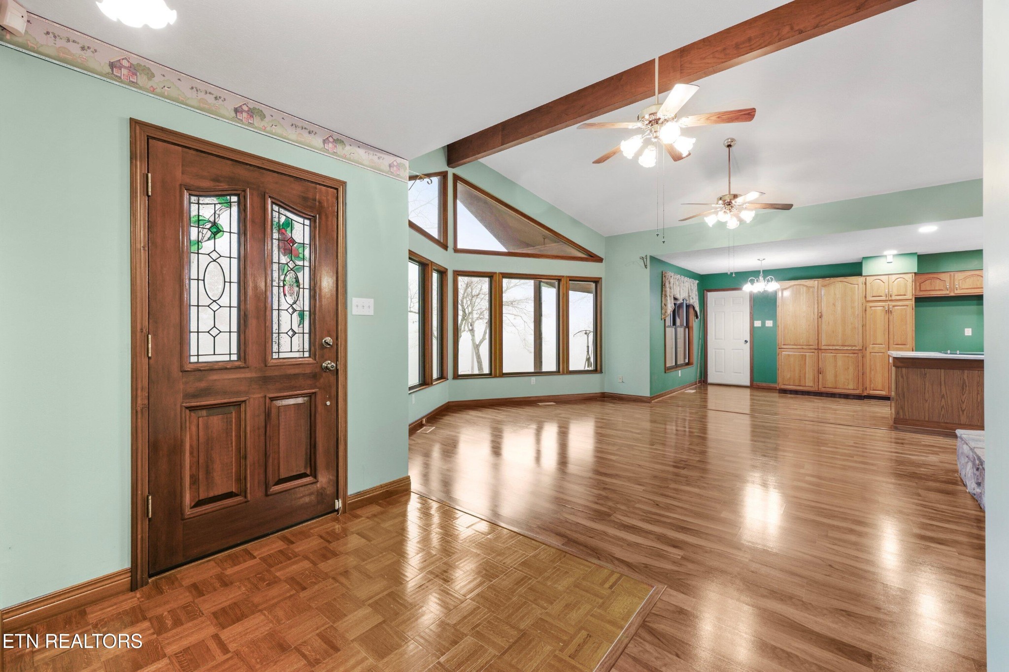 235 Davidson Hollow Road Heiskell, TN 37754 - Photo 28 of 43 a view of an entryway with wooden floor and a livingroom