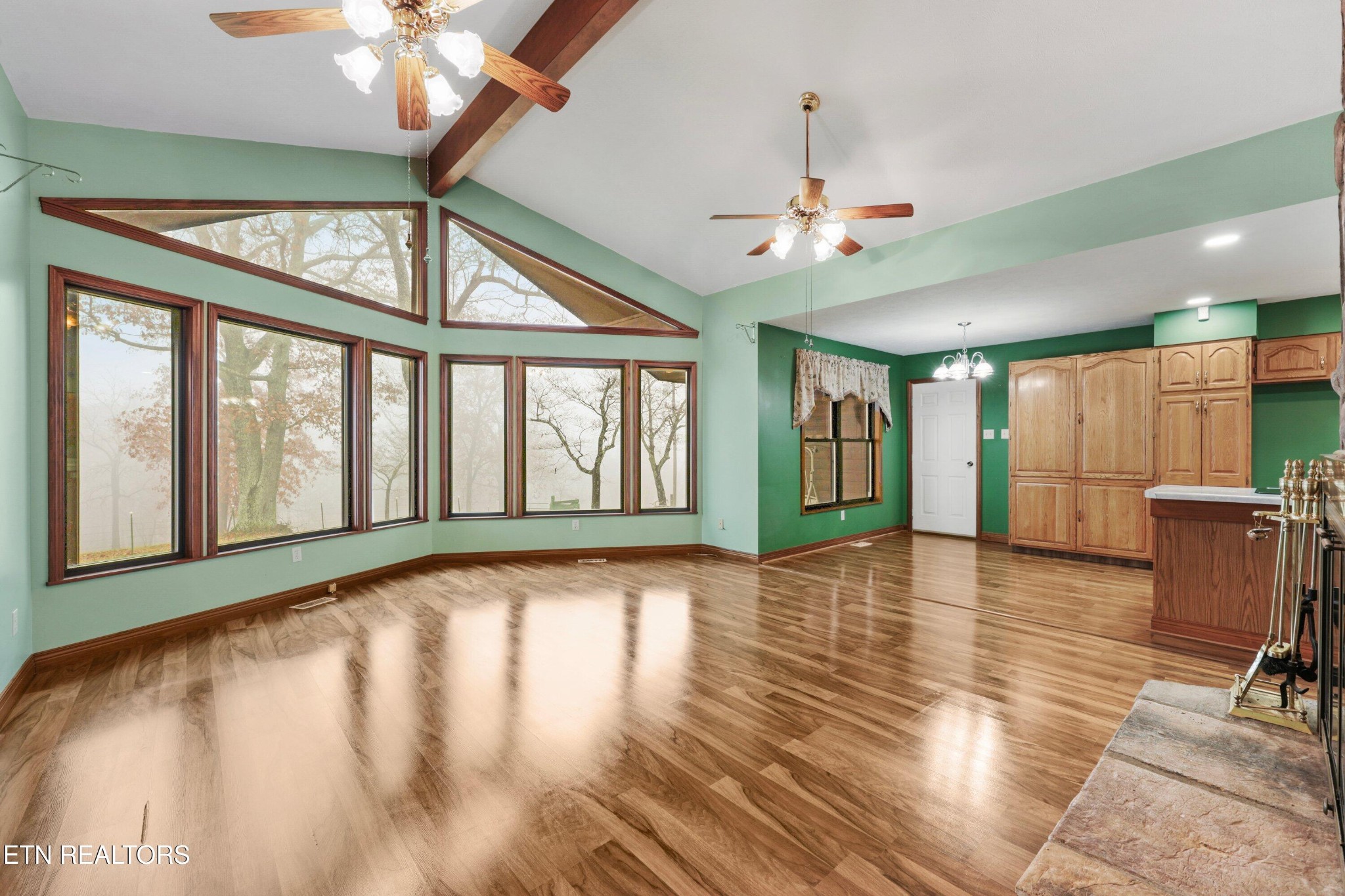 235 Davidson Hollow Road Heiskell, TN 37754 - Photo 30 of 43 a view of an empty room with a window and wooden floor