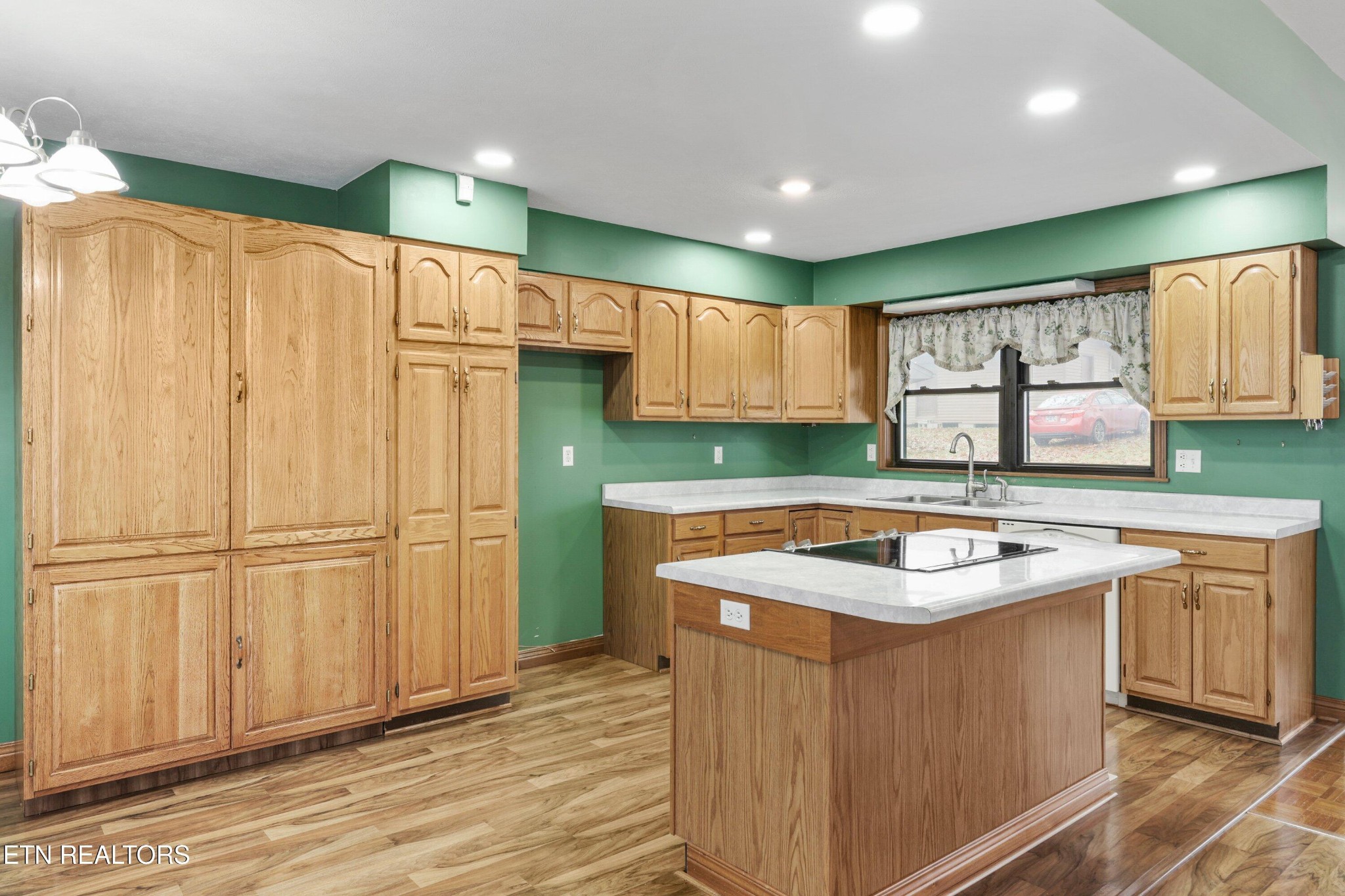 235 Davidson Hollow Road Heiskell, TN 37754 - Photo 34 of 43 a kitchen with stainless steel appliances granite countertop a sink stove and cabinets