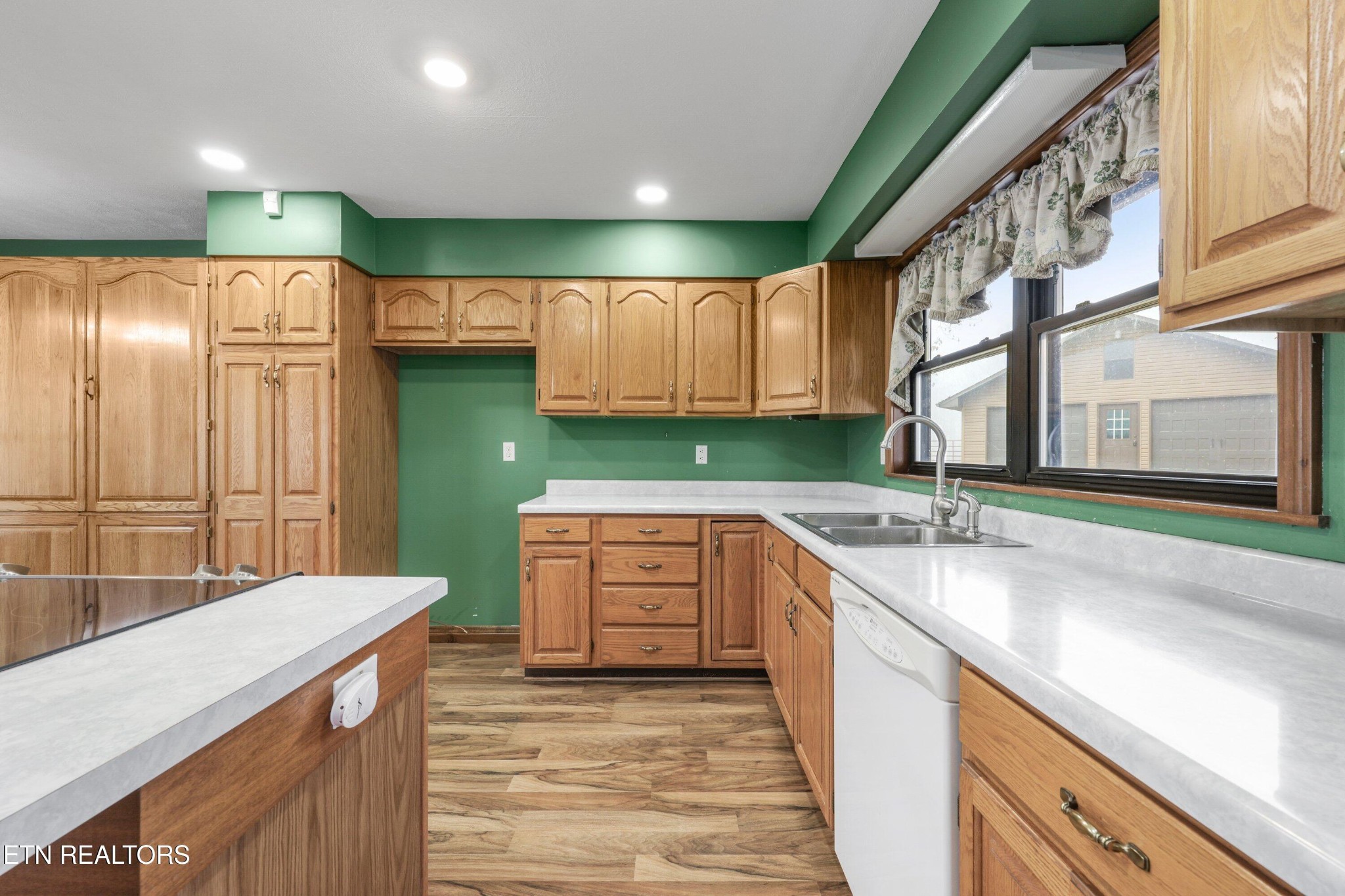 235 Davidson Hollow Road Heiskell, TN 37754 - Photo 35 of 43 a kitchen with a sink stove and cabinets