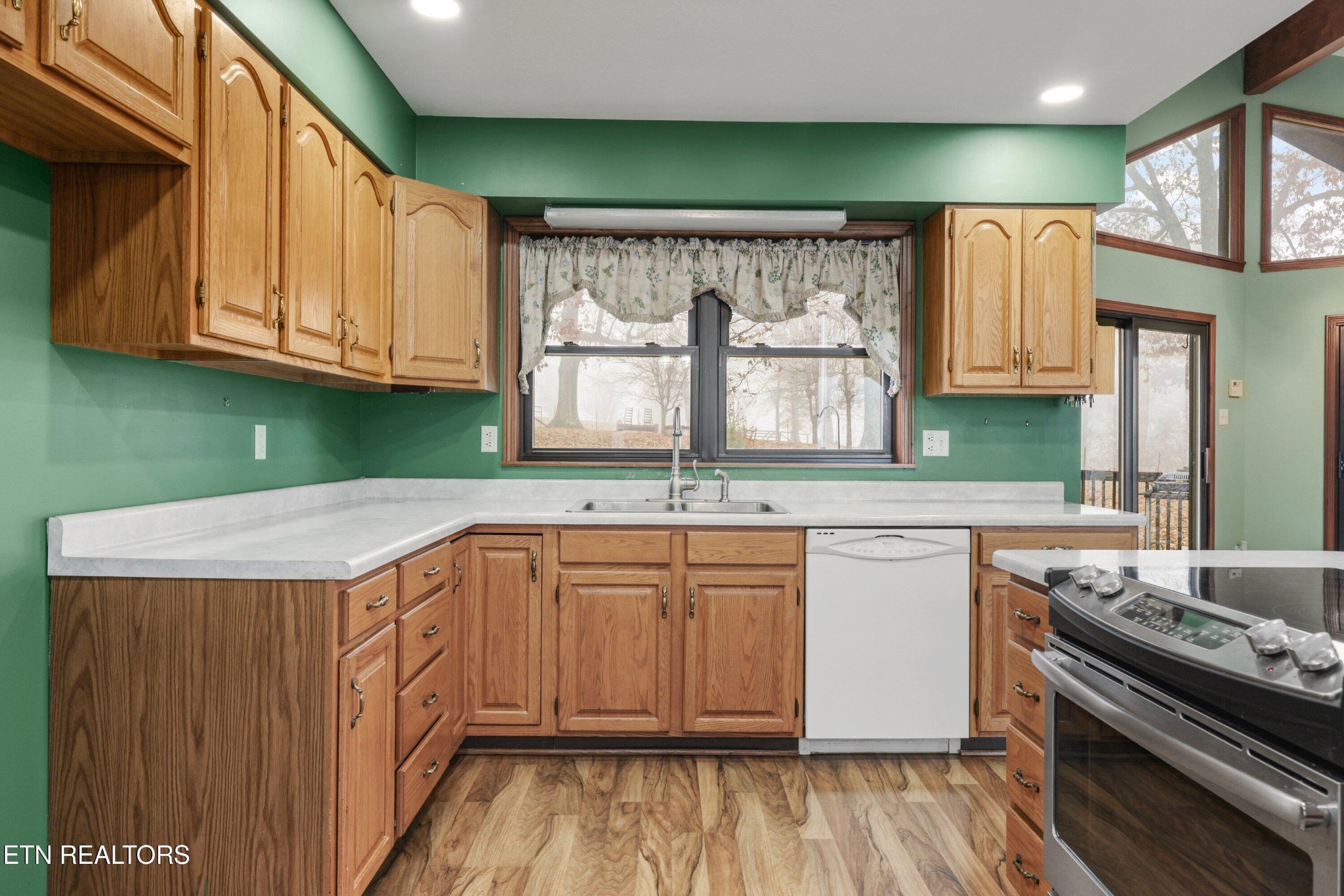 235 Davidson Hollow Road Heiskell, TN 37754 - Photo 36 of 43 a kitchen with a sink and a stove top oven