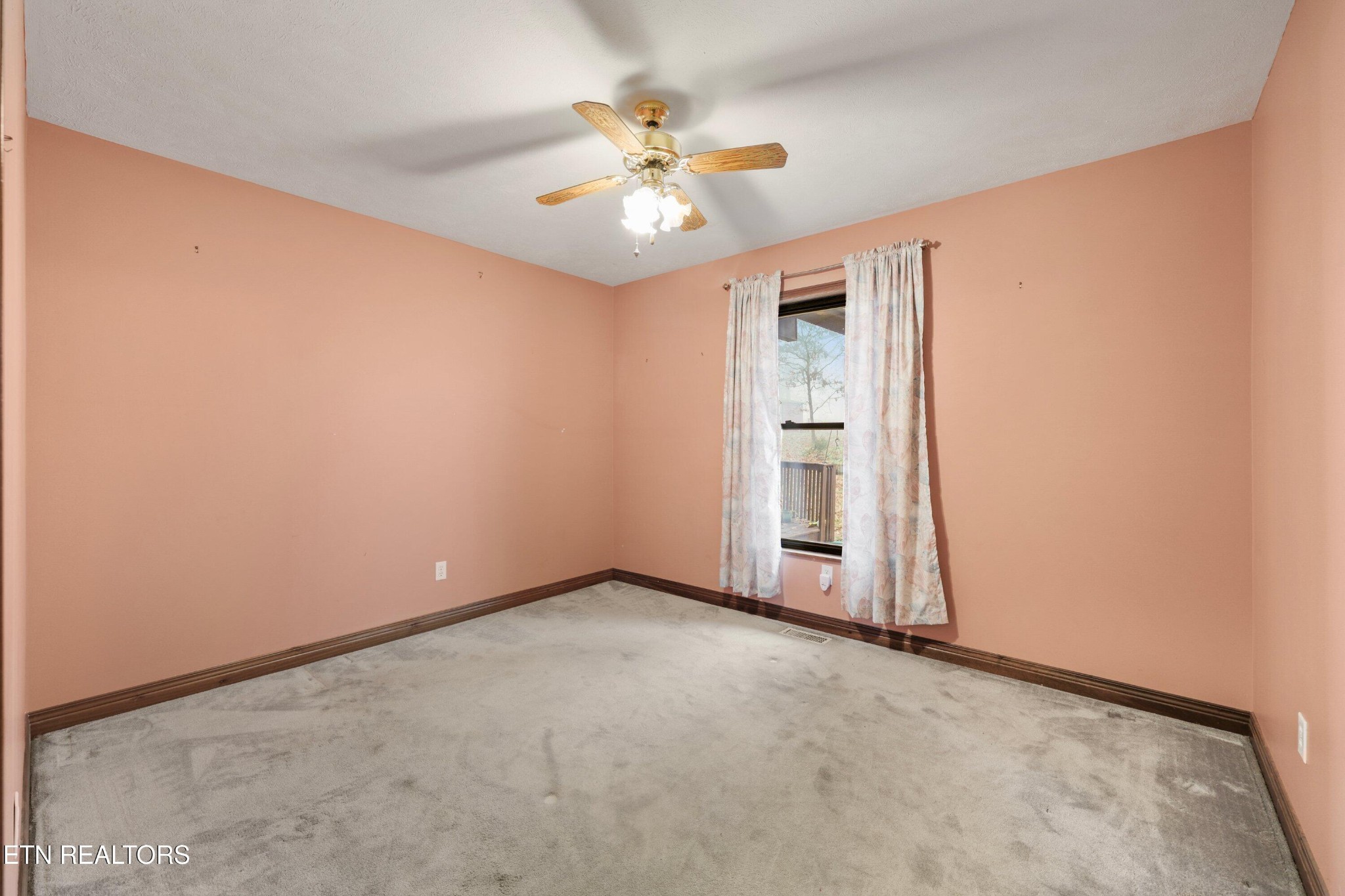 235 Davidson Hollow Road Heiskell, TN 37754 - Photo 41 of 43 an empty room with closet and a ceiling fan
