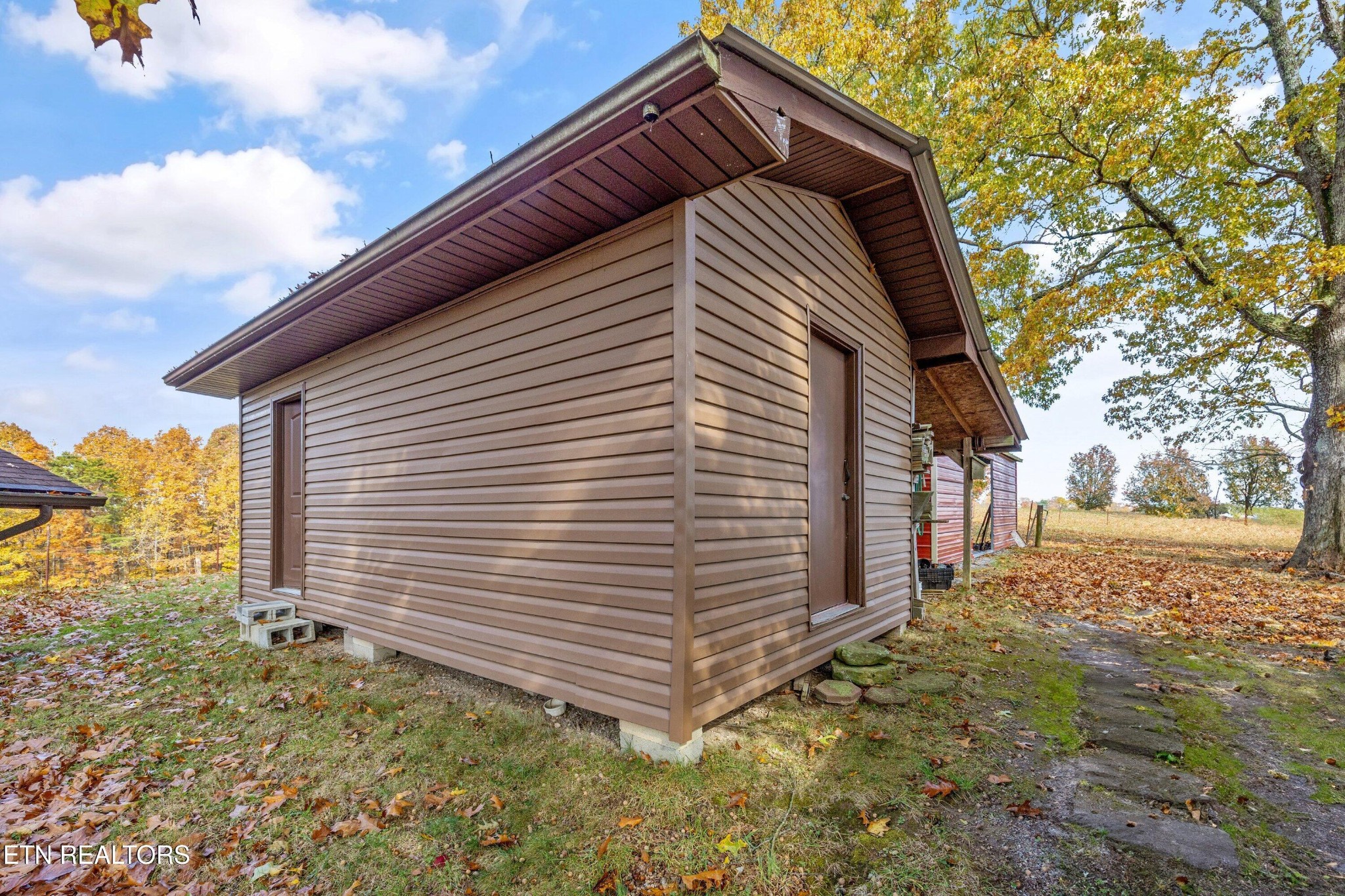 235 Davidson Hollow Road Heiskell, TN 37754 - Photo 8 of 43 a view of a house with a yard