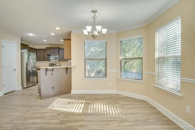 a view of a kitchen with marble kitchen and front door