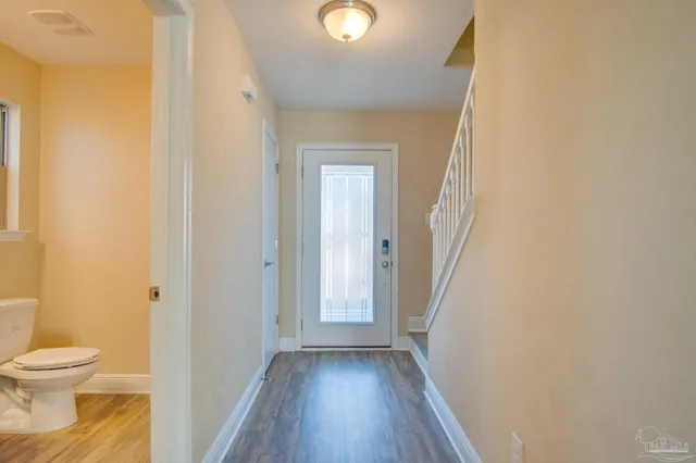 a view of a bathroom from a hallway