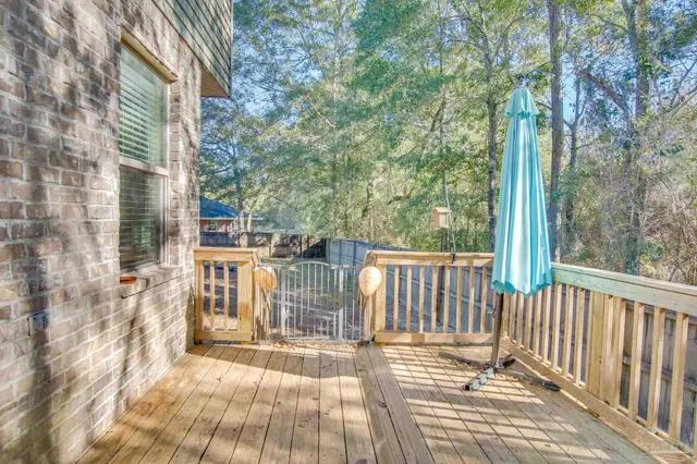 a view of a brick house with a yard