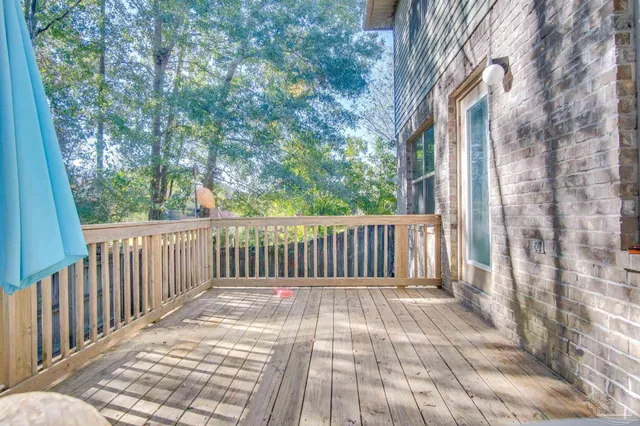 a view of a yard with large trees