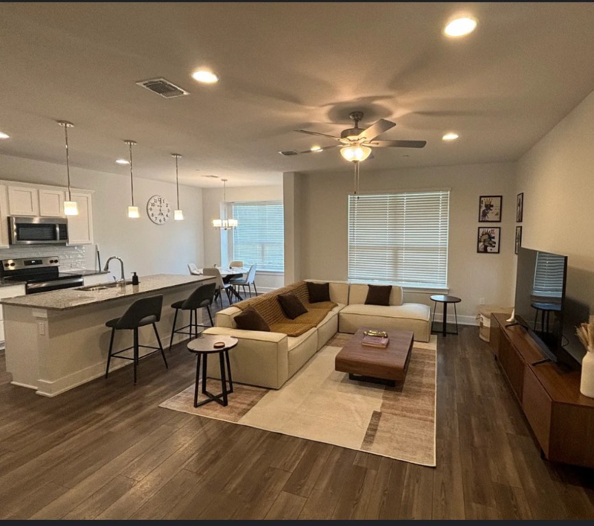 1709 Tun Tavern Trail Austin, TX 78754 - Photo 4 of 10 a living room with furniture and a flat screen tv