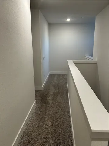 a bathroom with a shower sink and mirror