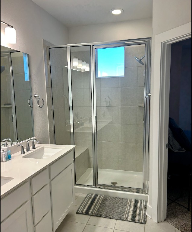 1709 Tun Tavern Trail Austin, TX 78754 - Photo 7 of 10 a bathroom with a shower sink and mirror