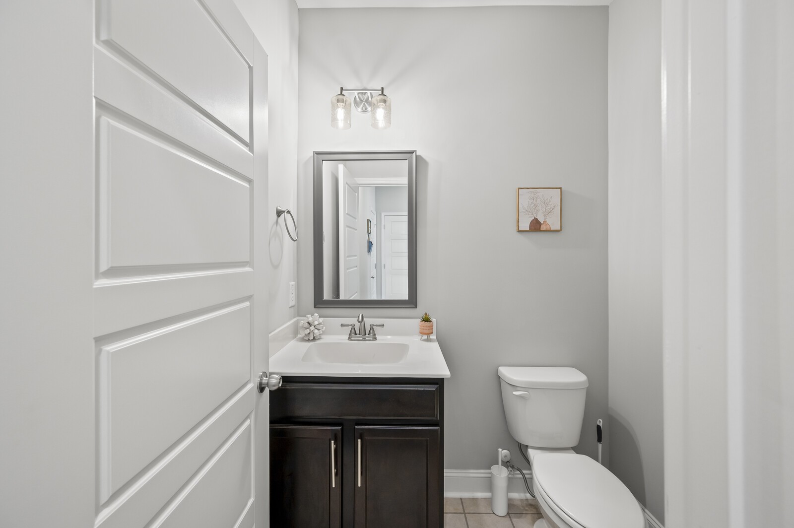 246 King Road Clarksville, TN 37042 - Photo 10 of 21 a bathroom with a sink a toilet and mirror