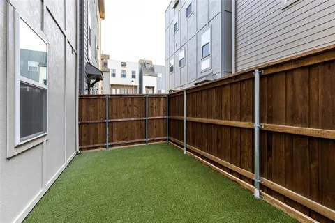 a view of backyard with large windows