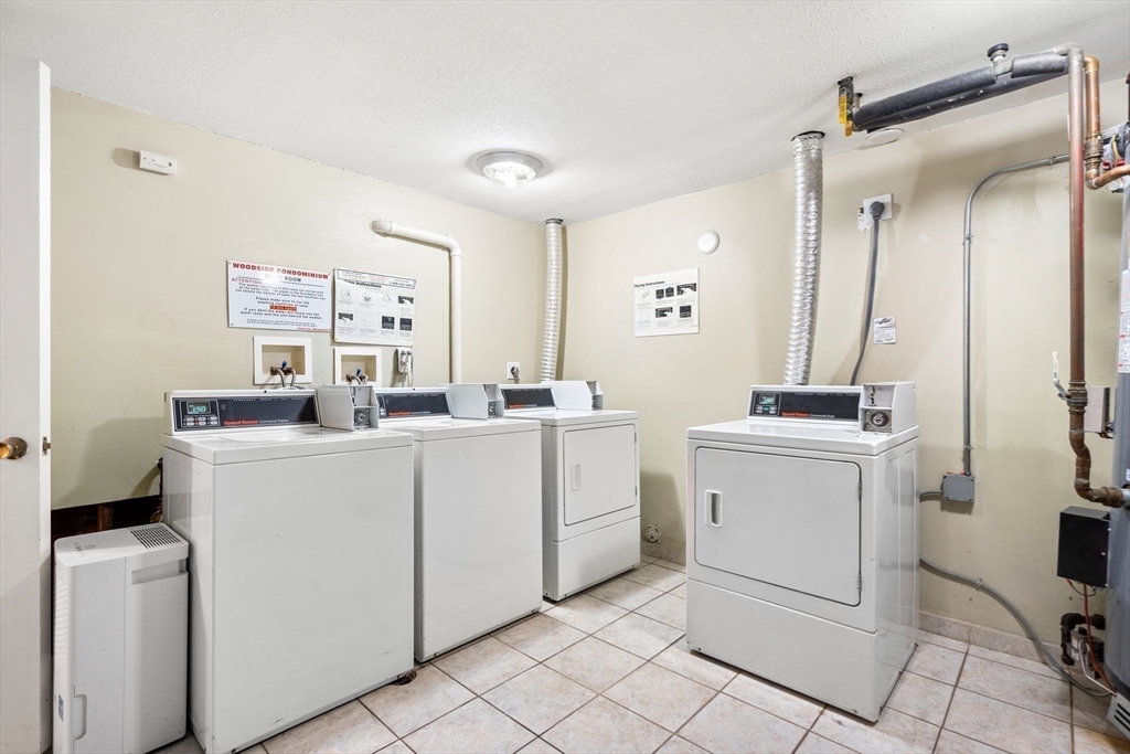 870 Haverhill Street, Unit 21B Rowley, MA 01969 - Photo 13 of 14 a room with a washing machine and dryer