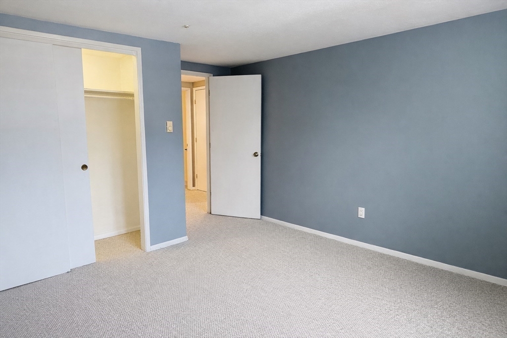 870 Haverhill Street, Unit 21B Rowley, MA 01969 - Photo 8 of 14 a view of an empty room with a window