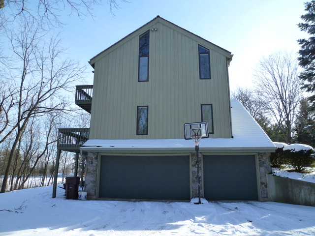 4012 Oak Ridge Road Crystal Lake, IL 60012 - Photo 3 of 24 a front view of a house with garage