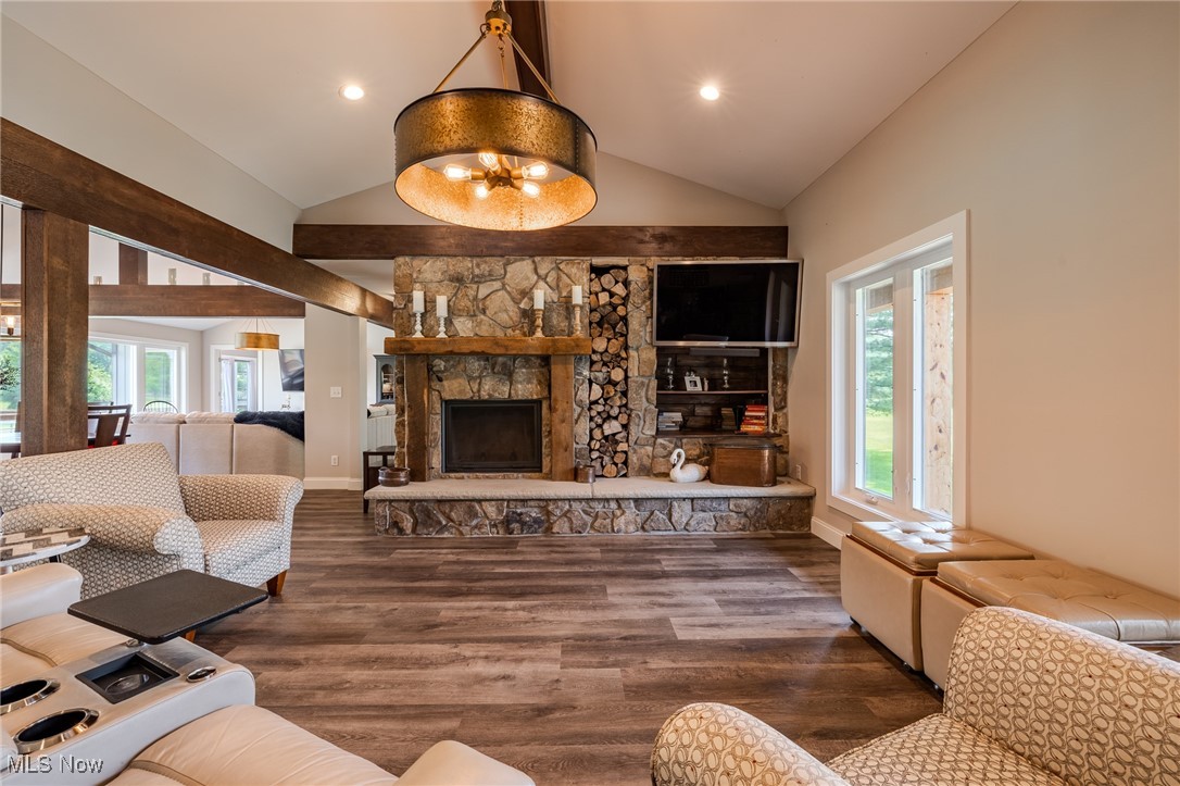 6268 Summers Road Windsor, OH 44099 - Photo 19 of 49 Living area featuring plenty of natural light, wood finished floors, a fireplace, recessed lighting, and high vaulted ceiling