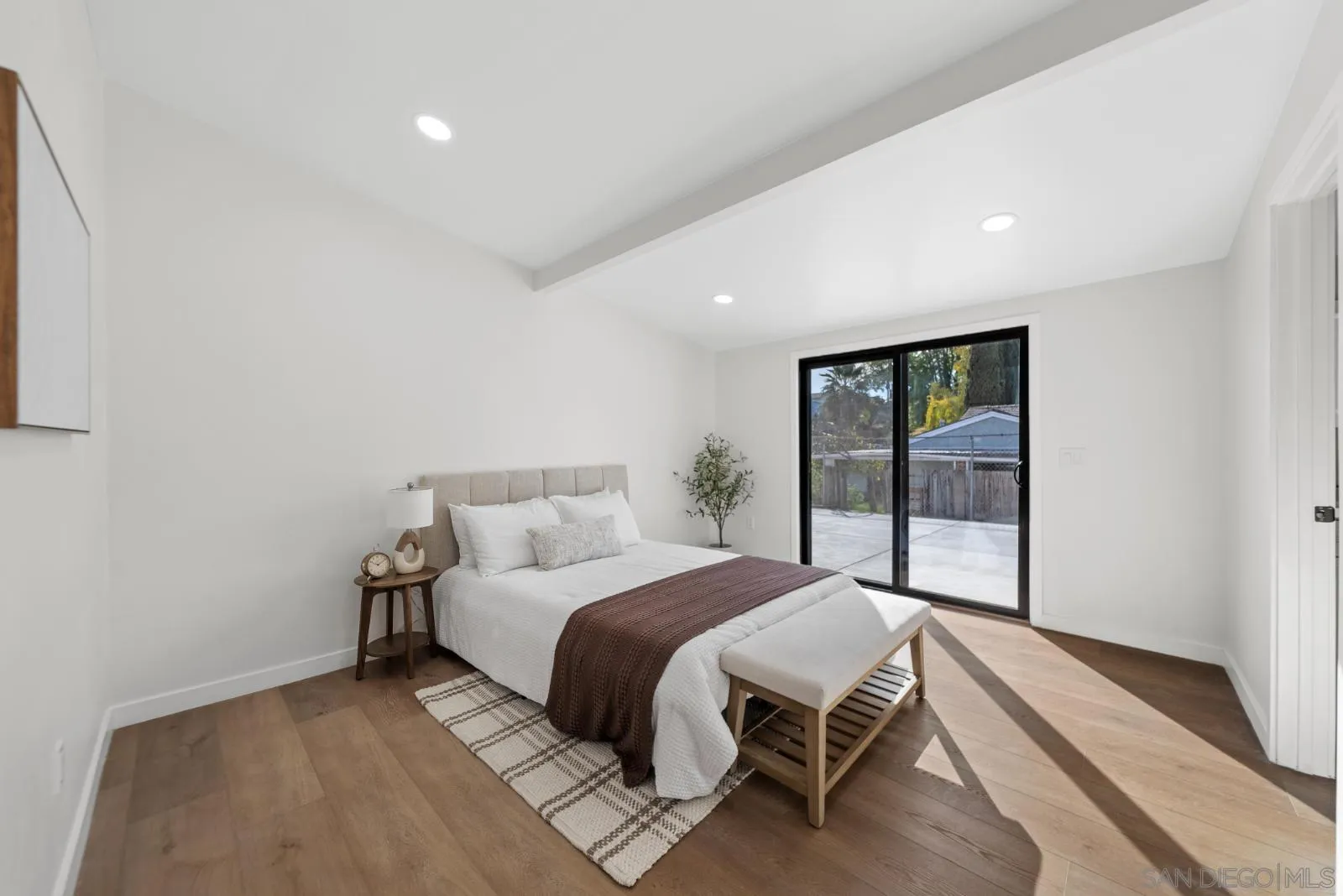 661 Concepcion Avenue Spring Valley, CA 91977 - Photo 19 of 43 a bedroom with a bed and large window