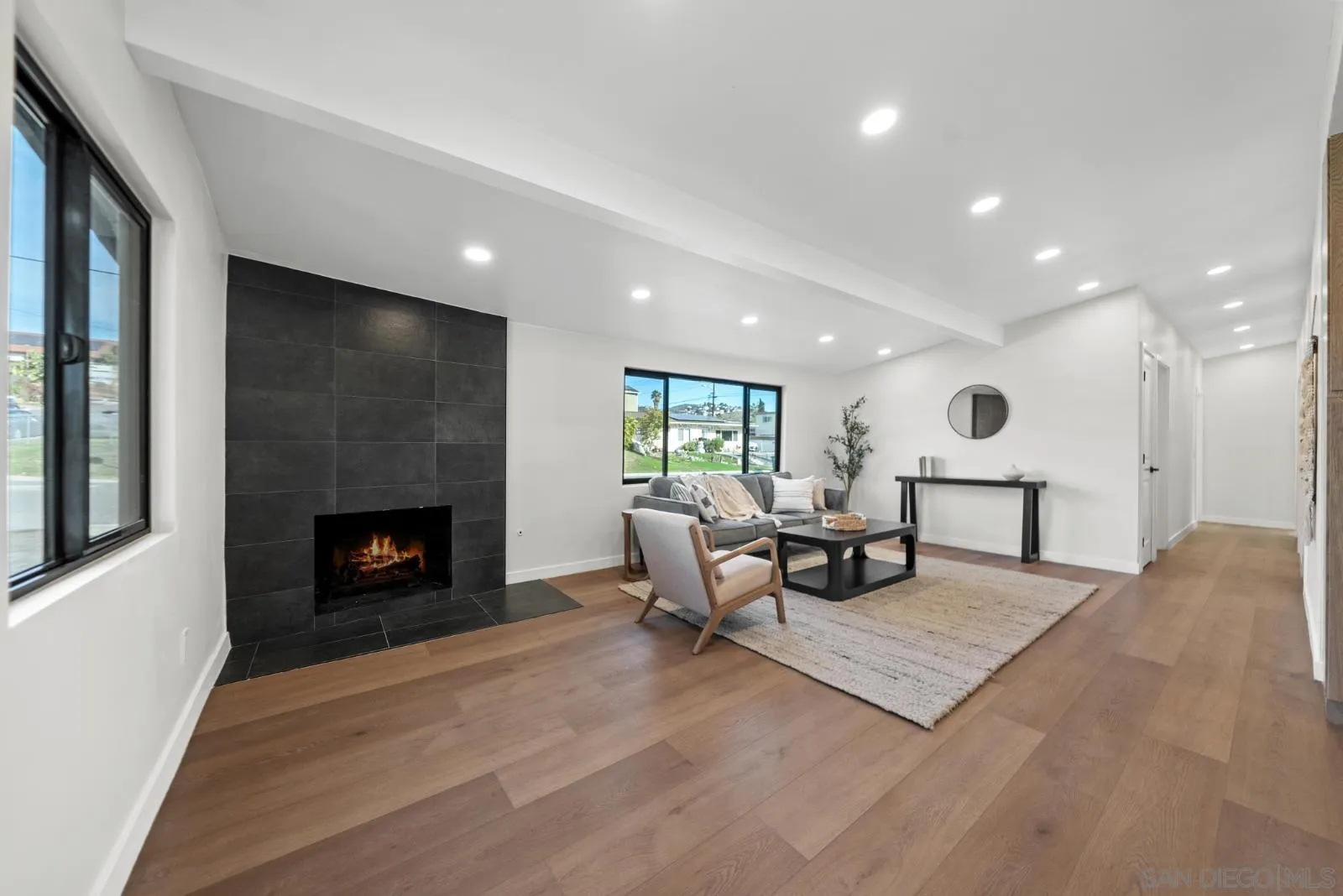 661 Concepcion Avenue Spring Valley, CA 91977 - Photo 2 of 43 a living room with furniture and a fireplace