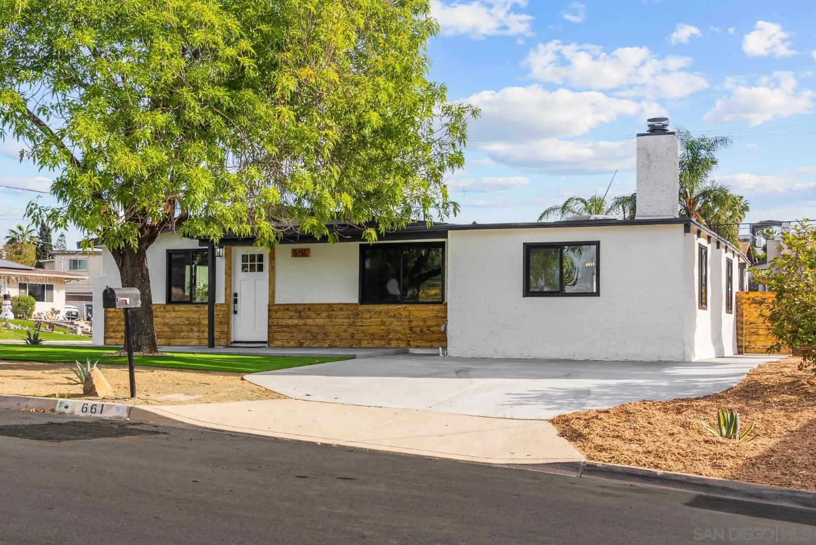 661 Concepcion Avenue Spring Valley, CA 91977 - Photo 7 of 43 a house that has a tree in front of it