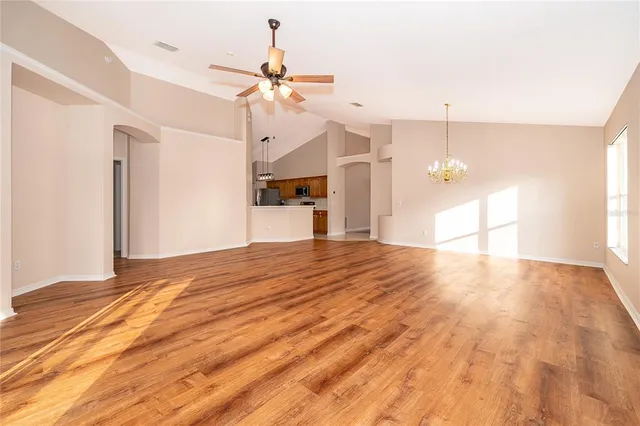 a view of empty room and wooden floor
