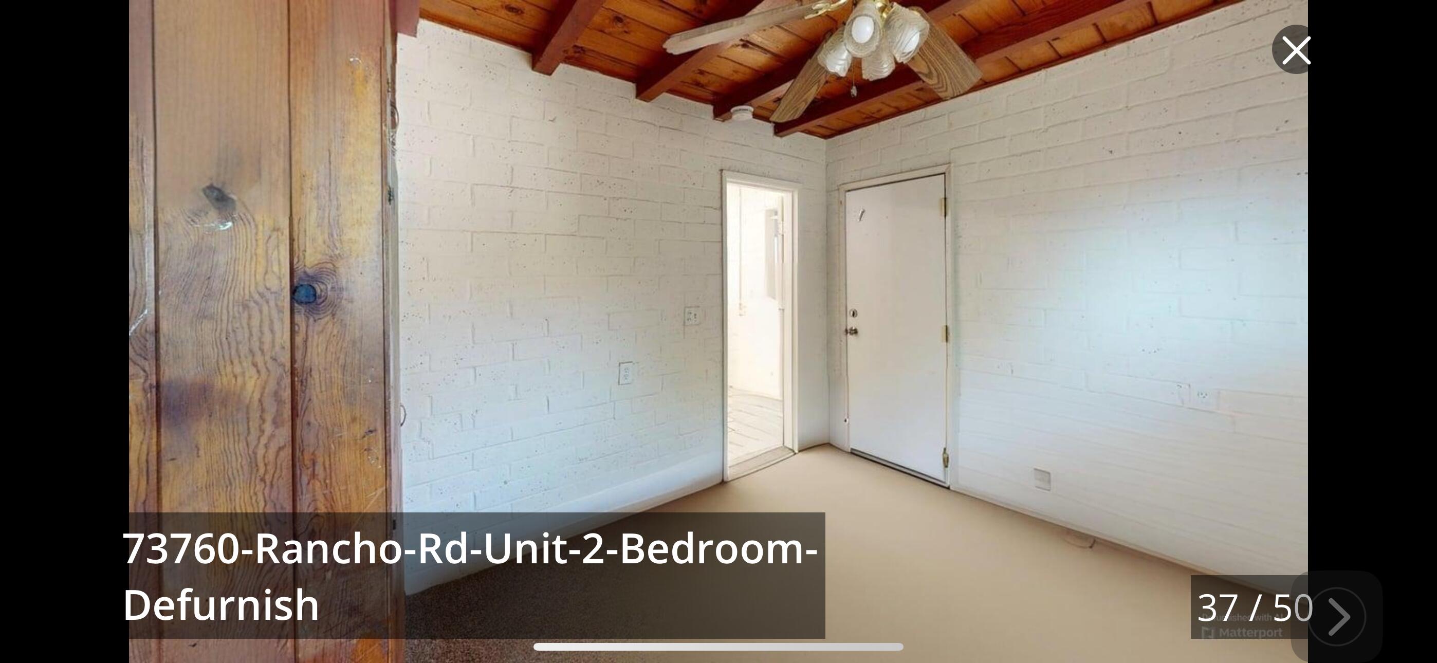 73760 Rancho Road Palm Desert, CA 92260 - Photo 20 of 27 a view of a wooden door