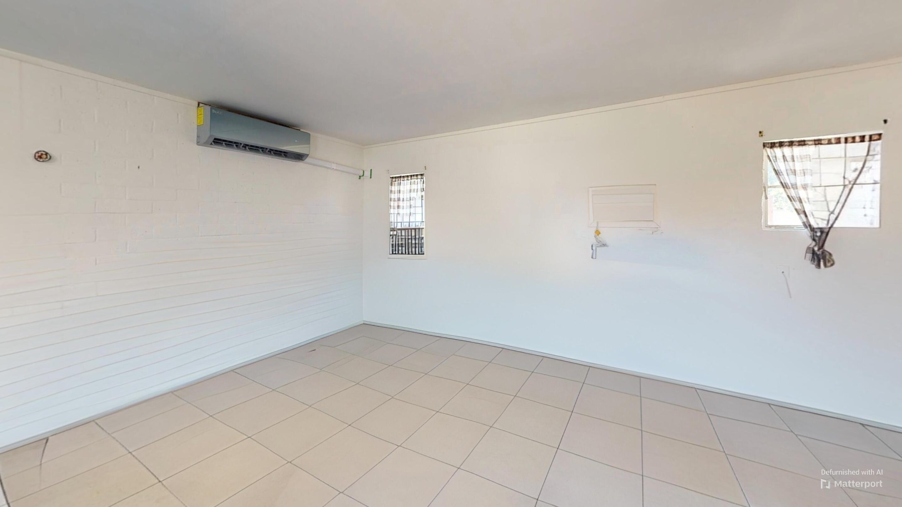 73760 Rancho Road Palm Desert, CA 92260 - Photo 21 of 27 an empty room with windows