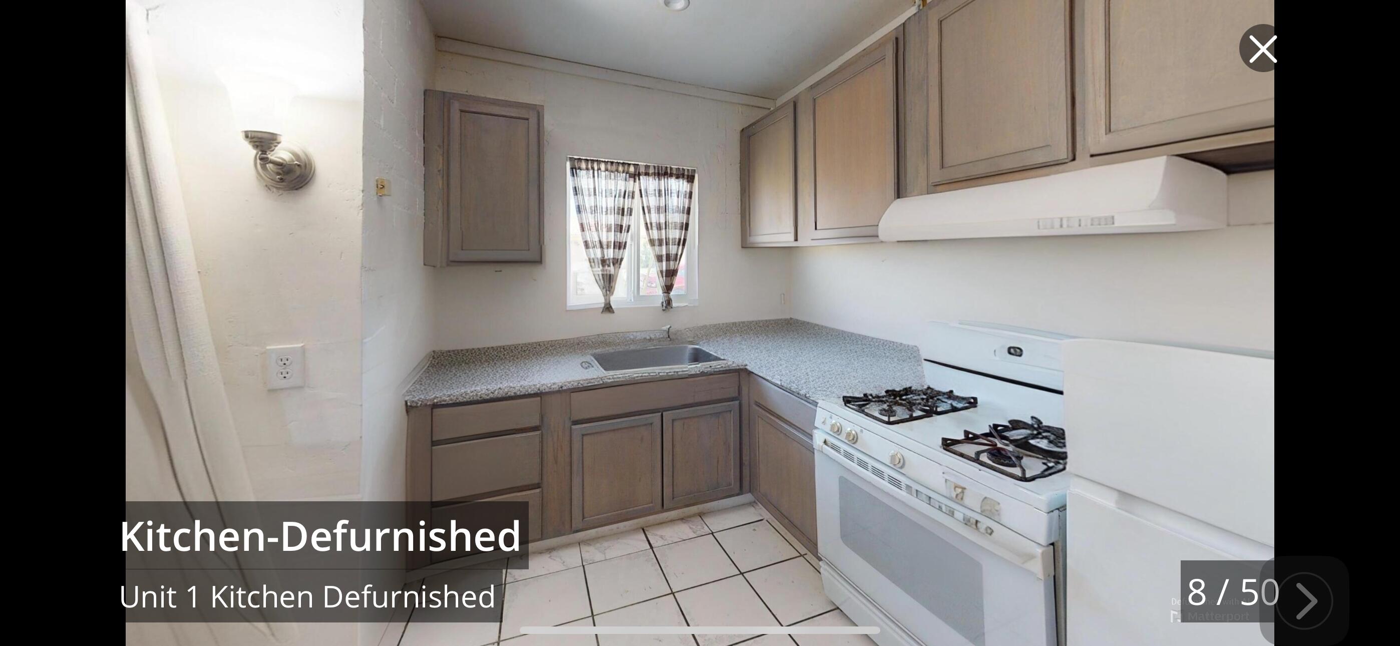 73760 Rancho Road Palm Desert, CA 92260 - Photo 5 of 27 a kitchen with granite countertop a sink and a stove