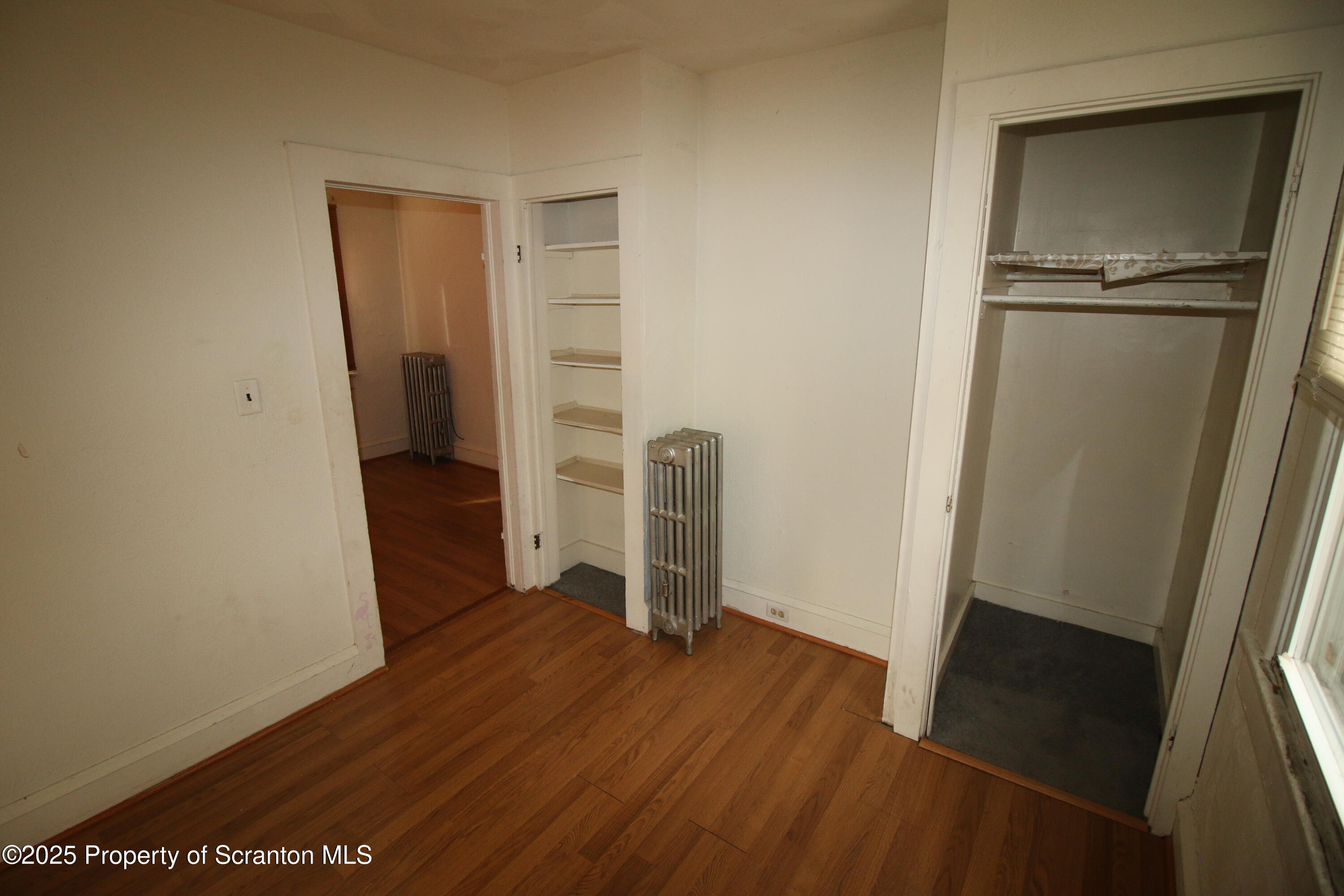 513 Hickory Street Scranton, PA 18505 - Photo 13 of 15 a view of empty room with wooden floor