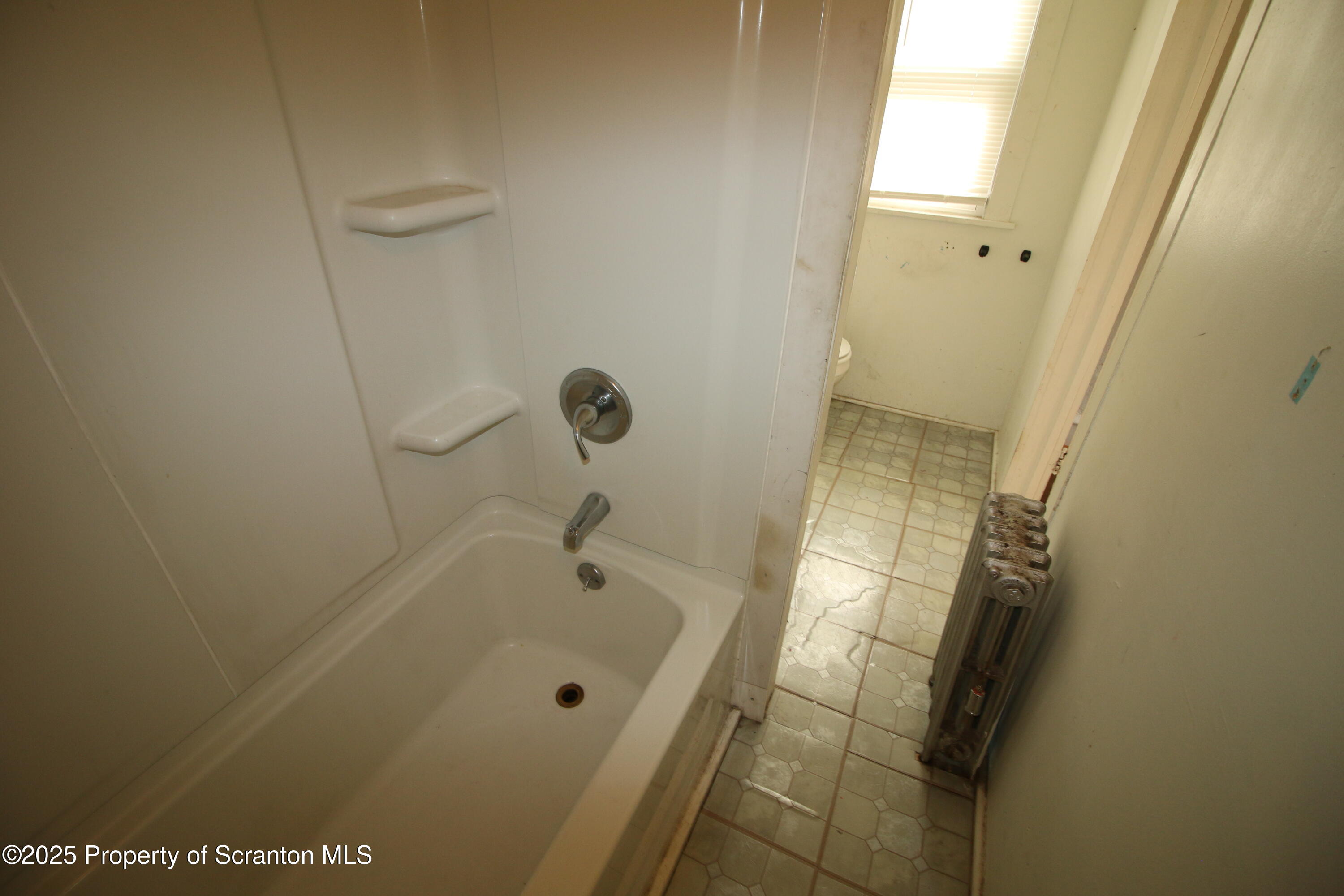 513 Hickory Street Scranton, PA 18505 - Photo 15 of 15 a bathroom with a tub and shower