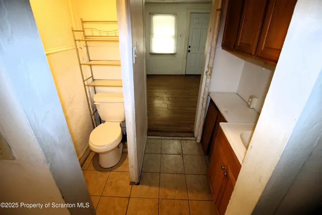 a bathroom with a toilet and a sink