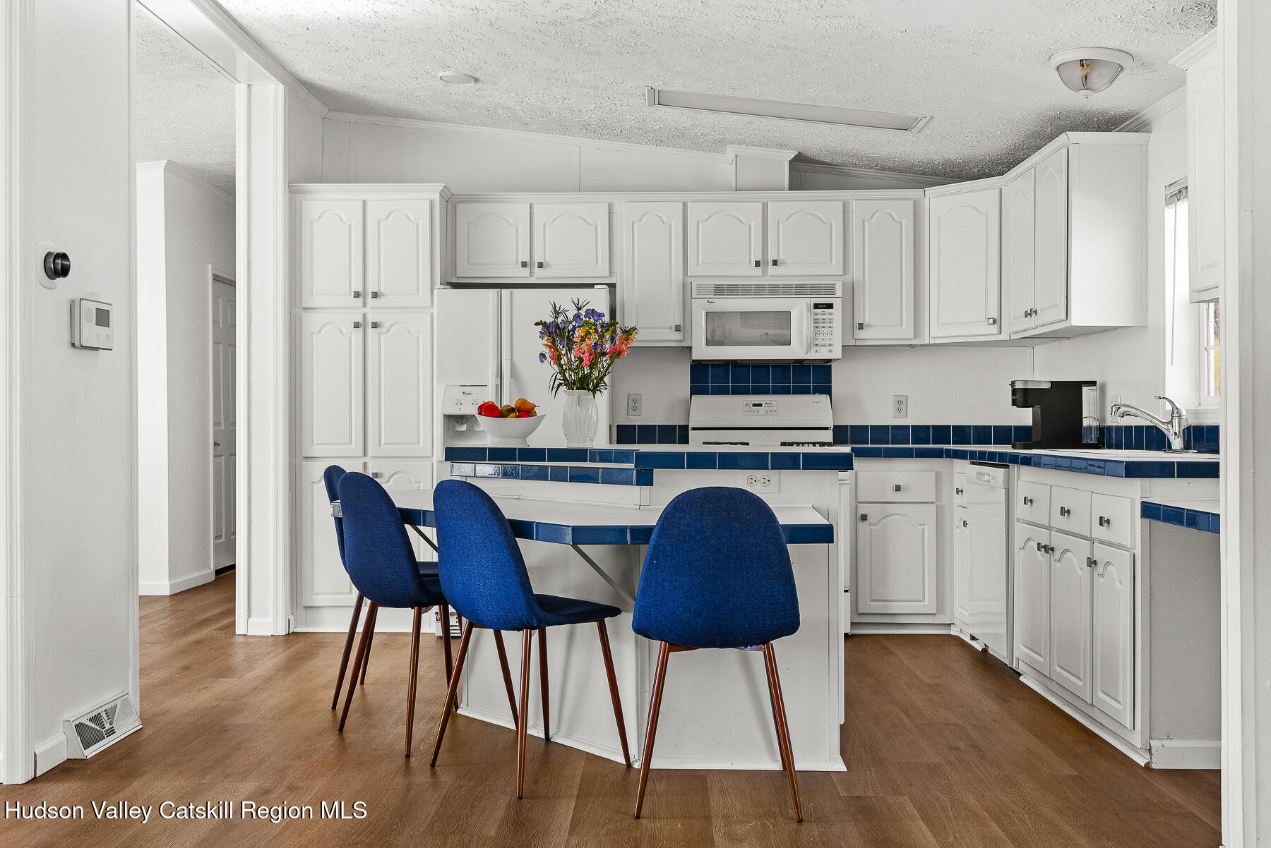 2685 Red Kill Road Fleischmanns, NY 12430 - Photo 13 of 31 a kitchen with stainless steel appliances granite countertop a white cabinets and wooden floor
