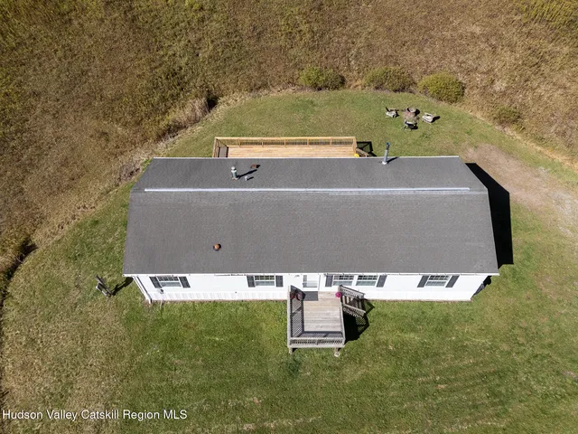 an aerial view of residential house with outdoor space