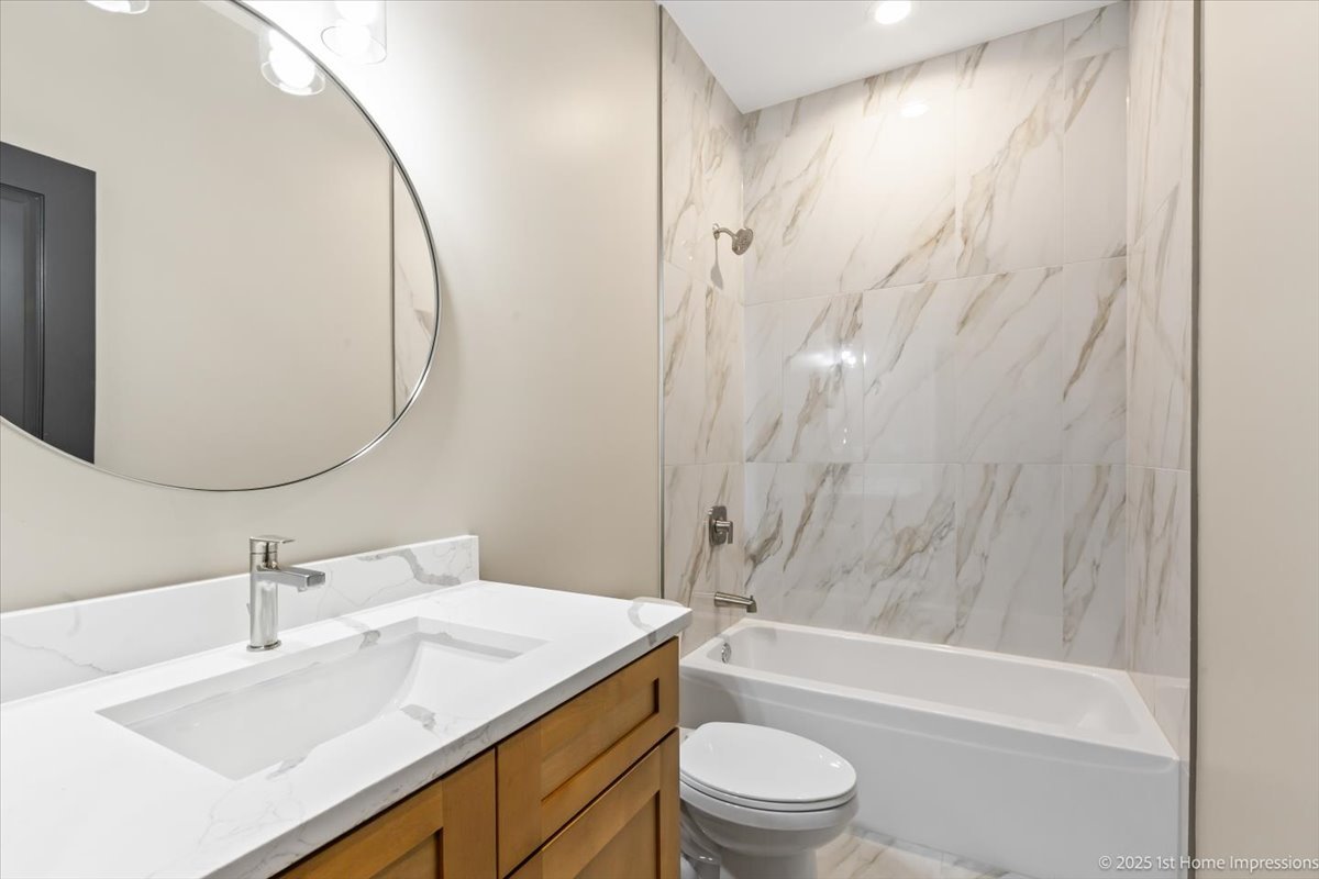4934 South Champlain Avenue Chicago, IL 60615 - Photo 14 of 25 a bathroom with a sink toilet and shower
