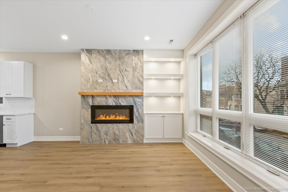 4934 South Champlain Avenue Chicago, IL 60615 - Photo 4 of 25 a view of a room with a fireplace and a window