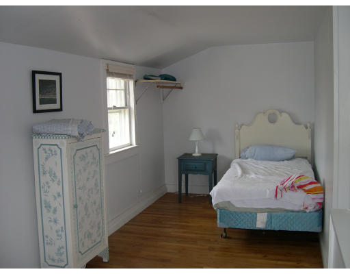 32 R Brunswick Street Scituate, MA 02047 - Photo 3 of 3 a bedroom with a bed and wooden floor