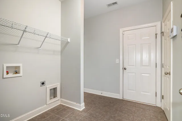 a kitchen with stainless steel appliances granite countertop a stove top oven a sink dishwasher and a microwave oven on the blue kitchen countertops