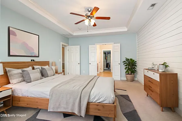 a view of a livingroom with a ceiling fan and window