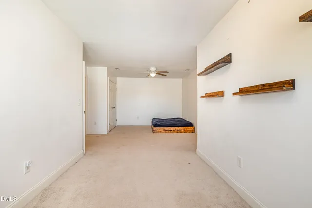 a view of a storage & utility room with a window