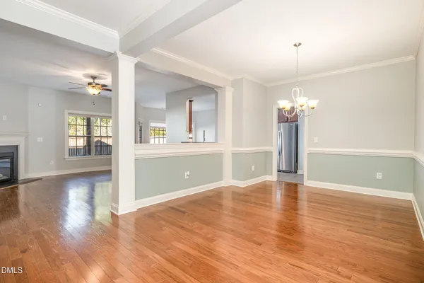 a living room with furniture a fireplace and a window
