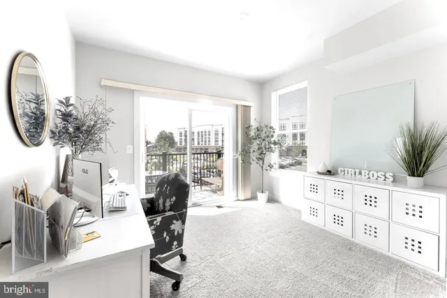 a view of a bedroom with a workspace