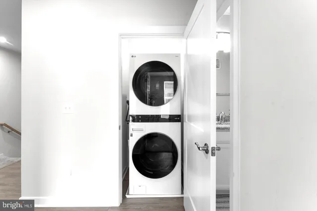 a spacious bedroom with a bed and a dresser