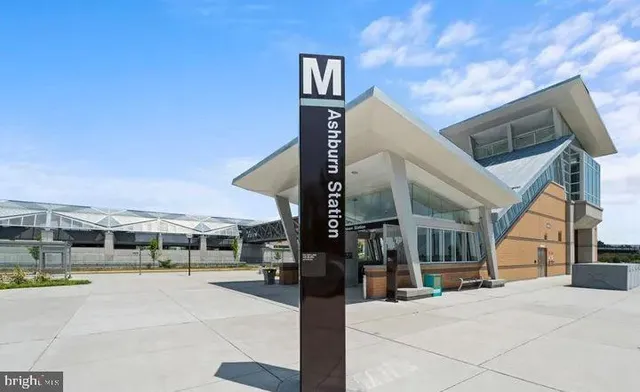 a outdoor view of a building with traffic signal lights
