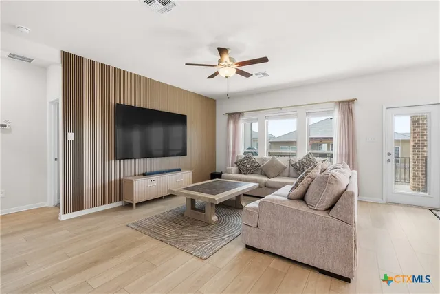 a bathroom with a double vanity sink and mirror with shower
