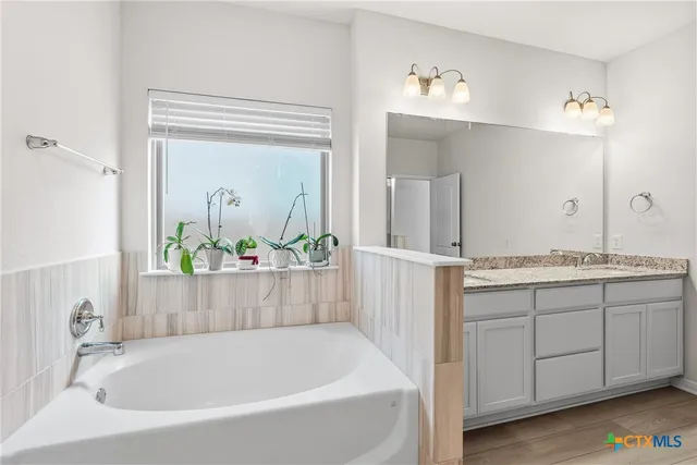 a living room with furniture a couch and a chandelier