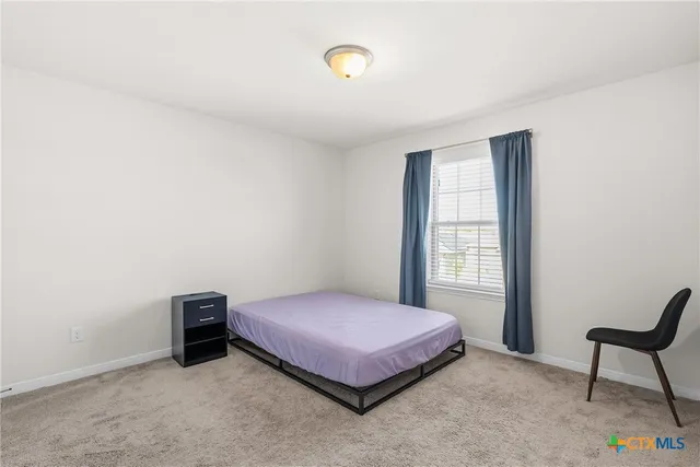 a view of multiple houses with a city view